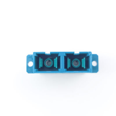 FTTH SC Διορθωτής οπτικών ινών με υλικό UPC Eared Dustproof Duplex Coupler PBT